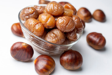 Chestnut dessert and chestnuts on a plate. Traditional delicious Turkish dessert; chestnut candies (Kestane Sekeri)
