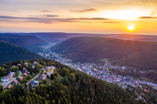Germany, Baden-Wurttemberg, Bad Wildbad, Aerial view of town in Black Forest at summer sunset