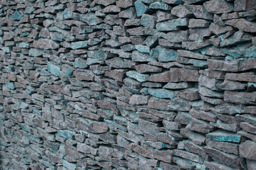 stone background. creative gray texture. colored mosaic. wall made of slabs	