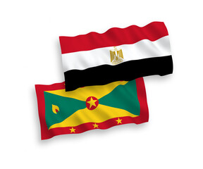 National vector fabric wave flags of Grenada and Egypt isolated on white background. 1 to 2 proportion.