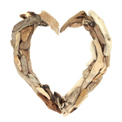Romantic natural driftwood heart shape on white background frame. Nature border symbol of love concept. Top view, flat lay, copy space. 