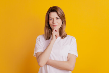 Photo of thoughtful minded clever business lady think finger chin wear casual outfit on yellow background