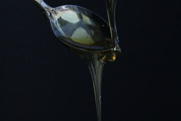 HONEY FLOWING FROM A SPOON