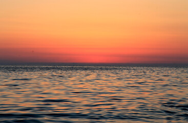 Subtropical sunset over sea. Tha Black sea seashore