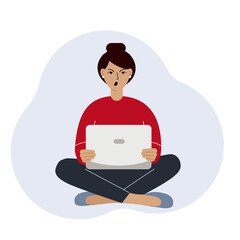 A woman or a girl sits and works at a laptop. Remote work or communication over the Internet. Angry, annoyed.