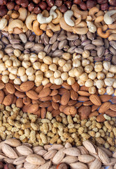 Obraz premium Mixed nuts on a white background