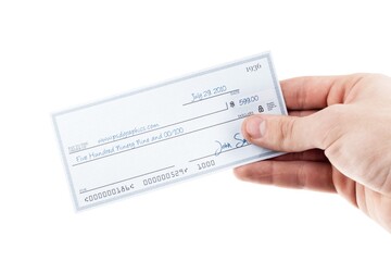 Writing a Check with a hand hold a paper