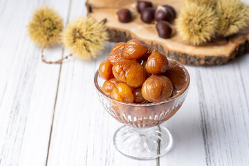 Chestnut dessert and chestnuts on a plate. Traditional delicious Turkish dessert; chestnut candies...