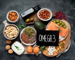 Assortment of omega 3 best sources on dark background.