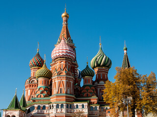 Fototapeta na wymiar Domes of St. Basil's Cathedral on a sunny autumn day. Red Square, Moscow, Russia. Close-up.