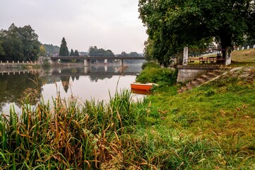 River Luznice, bank,boat and bridge in Kolodeje nad Luznici.