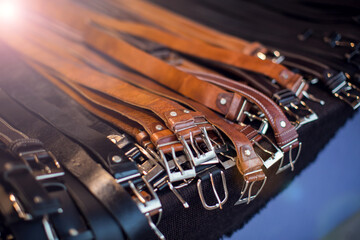 Obraz premium Men's belt of different colors in the shop