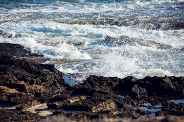 Waves crashing on the rocks.Weather and nature concept