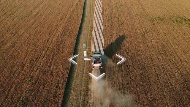 Aerial view of autonomous harvester on the field.  Digital transformation in agriculture