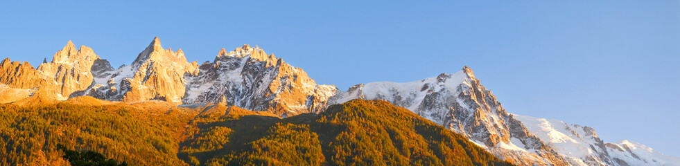 Peak of Mont Blanc, Alps on Sunset. Banner size. Chamonix city. Tourism and hospitality.