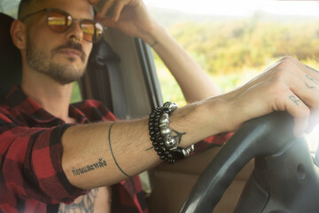 portrait of young man in the car 