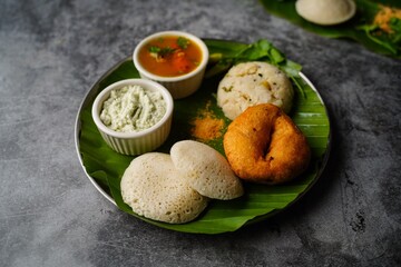 Vegetarian South Indian breakfast thali - Idli vada sambar chutney upma