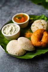 Vegetarian South Indian breakfast thali - Idli vada sambar chutney upma