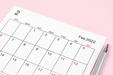 February 2022 calendar sheet with pen