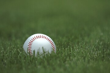 Baseball on neatly mowed grass