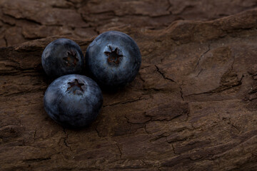  Blueberries ripe and tasty on a wooden table