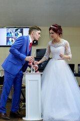 Kirov, Russia - June 20, 2020: : The bride and groom with candles. Russian tradition when a new family happiness is lit