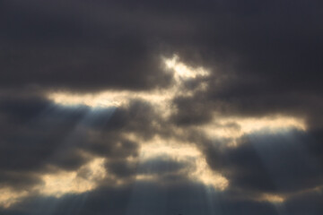 storm cloud with bright skylights of sunlight