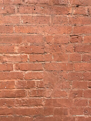 Brick red wall. Background of a old brick house.