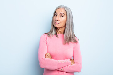 middle age gray hair woman feeling displeased and disappointed, looking serious, annoyed and angry with crossed arms