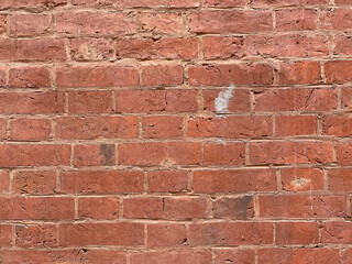 Brick red wall. Background of a old brick house.