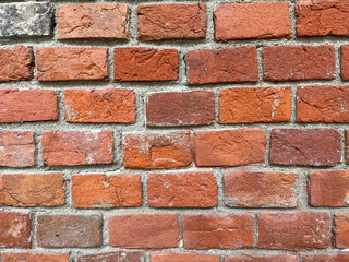 Brick red wall. Background of a old brick house.