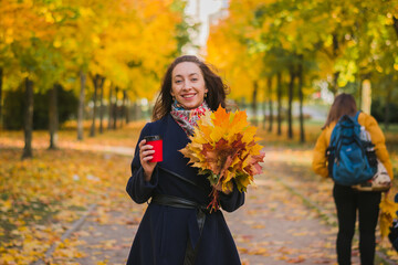 Beautiful glamorous girl portrait in autumn park