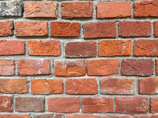 Brick red wall. Background of a old brick house.