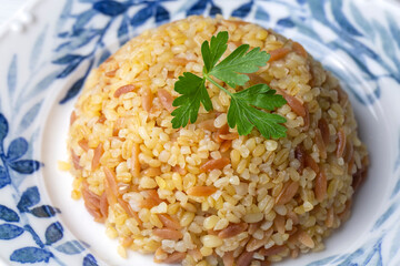 Traditional delicious Turkish food, bulgur pilaf with vermicelli (Turkish name; arpa sehriyeli bulgur pilavi)