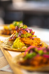 Spicy Mexican food tacos topped with a filling. Selective focus