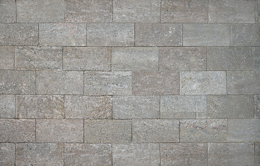 Grey cement brick wall horizontal masonry. Concrete wall texture background. Abstract wallpaper.