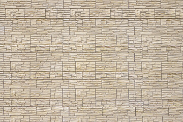 Pattern of beige decorative slate stone wall surface. Natural design granite material.