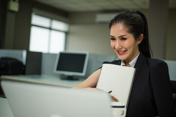 Beautiful business woman working and presenting work in office