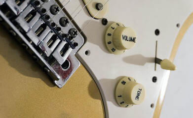 Golden electric guitar volume knob