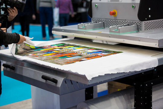 Helsinki, Finland - March 11, 2020: Big professional industrial printer Epson in action. Technology transfer images to the fabric. International fair Sign, Print, Pack at Messukeskus exhibition center
