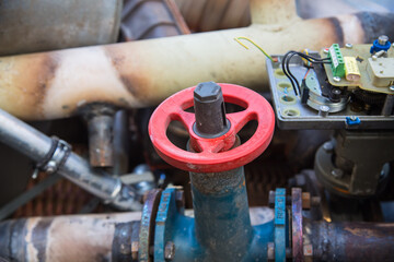 Special waste or valuable resources: Old rusty components of a heating boiler as pipes, counters,...