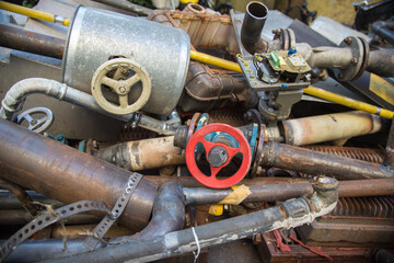 Special waste or valuable resources: Old rusty components of a heating boiler as pipes, counters,...