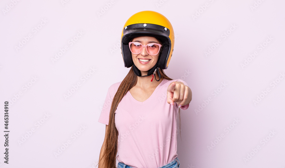 Poster young pretty woman with a motorbike helmet.