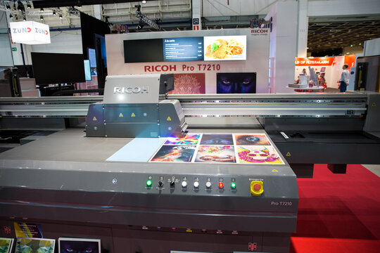 Helsinki, Finland - March 11, 2020: Big professional industrial printer Ricoh Pro T7210 in action. International fair Sign, Print and Pack at Messukeskus exhibition centre. 