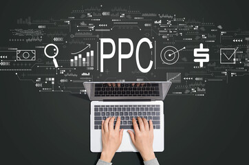 PPC - Pay per click concept with person using a laptop computer