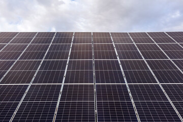 Solar panels on sky background