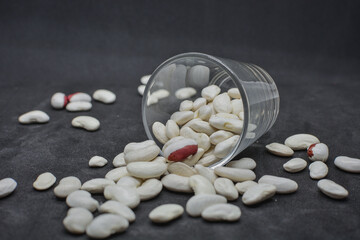 Grains of white beans in dried form .