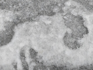 Closeup photo of slick frozen winter road after snow