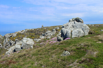 Fototapeta na wymiar Big stones of rocky coast of Pointe du Van in Brittany France. Tourism in France.