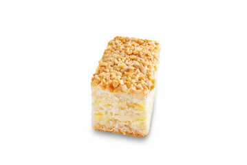 Sponge cake with cream and nuts on a white isolated background